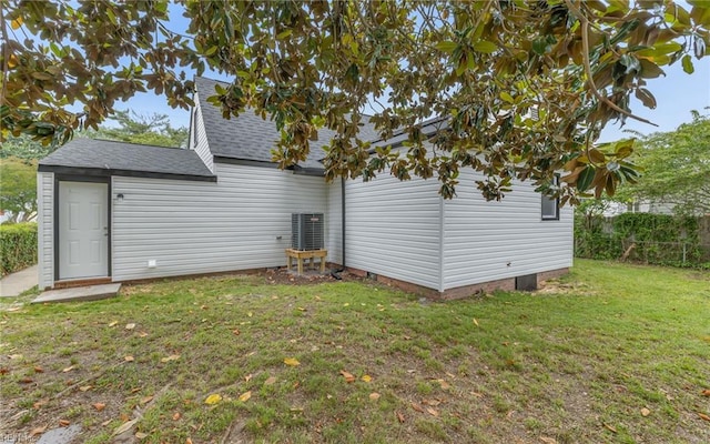 3506 Somme Ave, Norfolk, VA 23509 - rear view of house featuring a lawn, roof with shingles, crawl space, and central air condition unit
