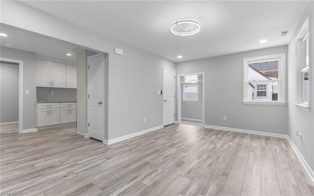 3506 Somme Ave, Norfolk, VA 23509 - unfurnished living room with light wood finished floors, baseboards, and recessed lighting