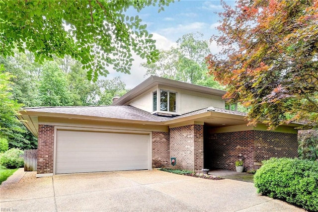 140 Hearthside Ln, Williamsburg, VA 23185 - traditional-style house featuring brick siding, concrete driveway, a garage, and stucco siding