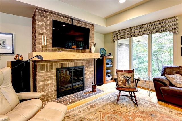 140 Hearthside Ln, Williamsburg, VA 23185 - living area with a fireplace and wood finished floors