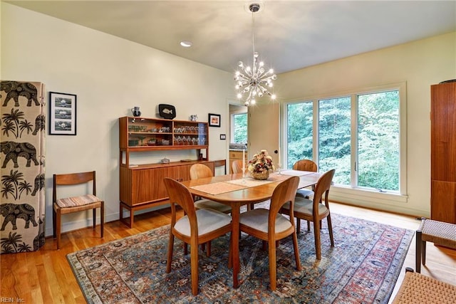 140 Hearthside Ln, Williamsburg, VA 23185 - dining area with a chandelier, healthy amount of natural light, and light wood finished floors