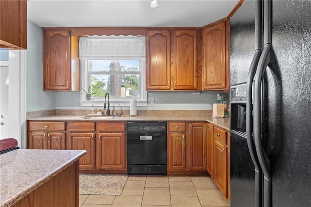 6615 Cabot Ave, Norfolk, VA 23502 - kitchen featuring black appliances, a sink, brown cabinets, and light tile patterned floors
