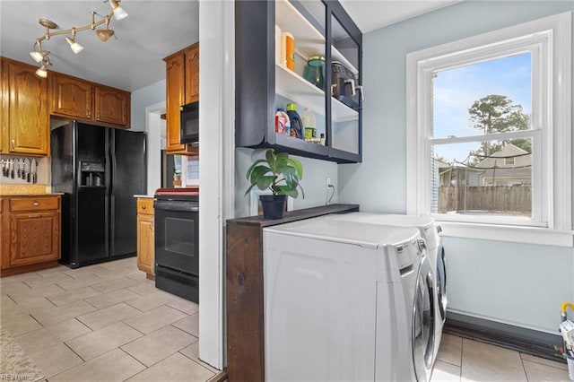 6615 Cabot Ave, Norfolk, VA 23502 - laundry room with separate washer and dryer, cabinet space, and light tile patterned floors