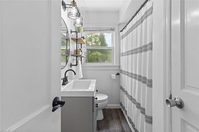 6615 Cabot Ave, Norfolk, VA 23502 - bathroom featuring vanity, toilet, wood finished floors, a shower with curtain, and baseboards