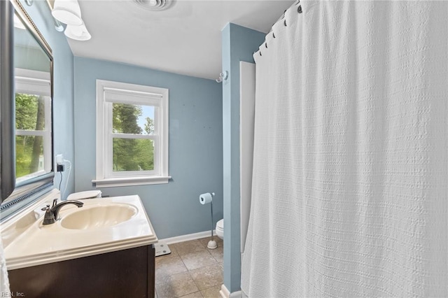 6615 Cabot Ave, Norfolk, VA 23502 - full bath featuring vanity, toilet, baseboards, tile patterned flooring, and curtained shower