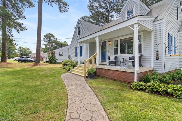 6615 Cabot Ave, Norfolk, VA 23502 - view of front of property with roof with shingles, a porch, and a front yard