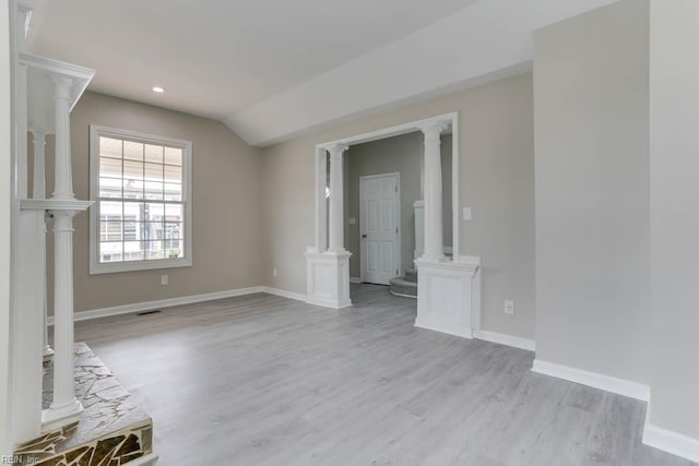 814 E 26th St, Norfolk, VA 23504 - unfurnished living room featuring light wood finished floors, baseboards, decorative columns, vaulted ceiling, and recessed lighting