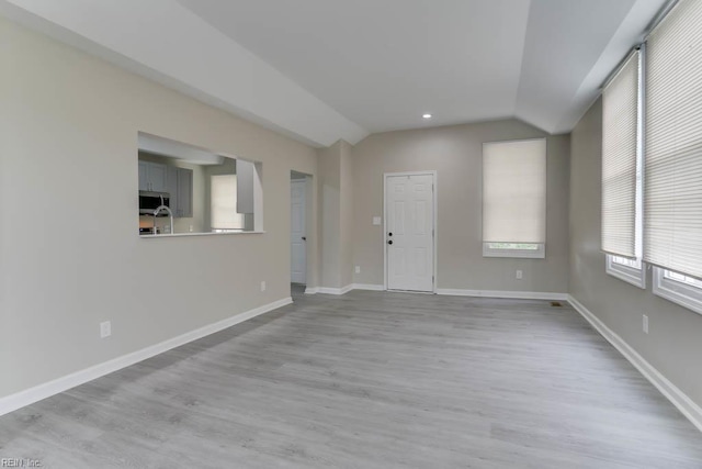 814 E 26th St, Norfolk, VA 23504 - spare room with vaulted ceiling, light wood-type flooring, and baseboards