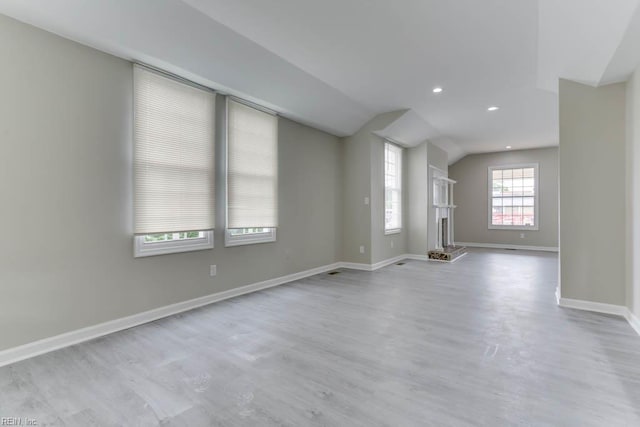 814 E 26th St, Norfolk, VA 23504 - unfurnished living room with lofted ceiling, wood finished floors, baseboards, and recessed lighting