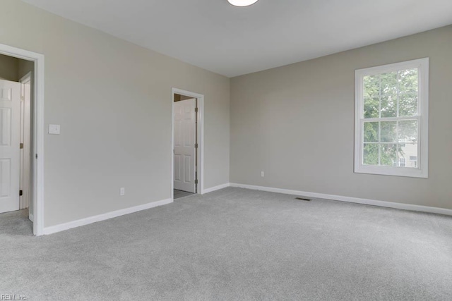 814 E 26th St, Norfolk, VA 23504 - carpeted empty room featuring baseboards