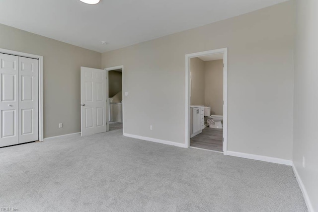 814 E 26th St, Norfolk, VA 23504 - unfurnished bedroom featuring light colored carpet, a closet, and baseboards