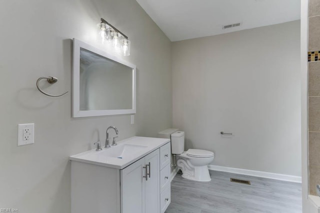814 E 26th St, Norfolk, VA 23504 - bathroom featuring vanity, toilet, baseboards, and wood finished floors