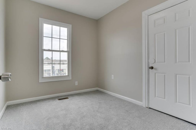 814 E 26th St, Norfolk, VA 23504 - carpeted empty room with baseboards