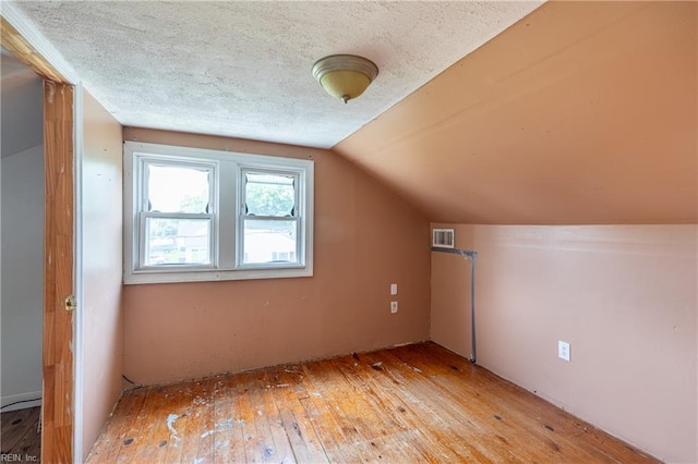 409 Wingfield Ave, Chesapeake, VA 23325 - bonus room with light wood finished floors, lofted ceiling, and a textured ceiling