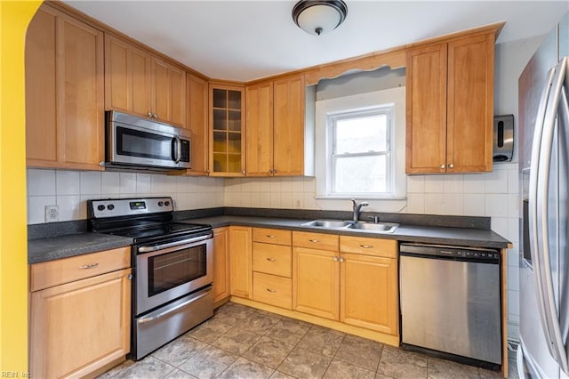 409 Wingfield Ave, Chesapeake, VA 23325 - kitchen featuring stainless steel appliances, a sink, dark countertops, and decorative backsplash