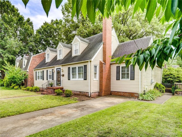 203 Sinclair St, Norfolk, VA 23505 - cape cod house with a shingled roof, a chimney, and driveway