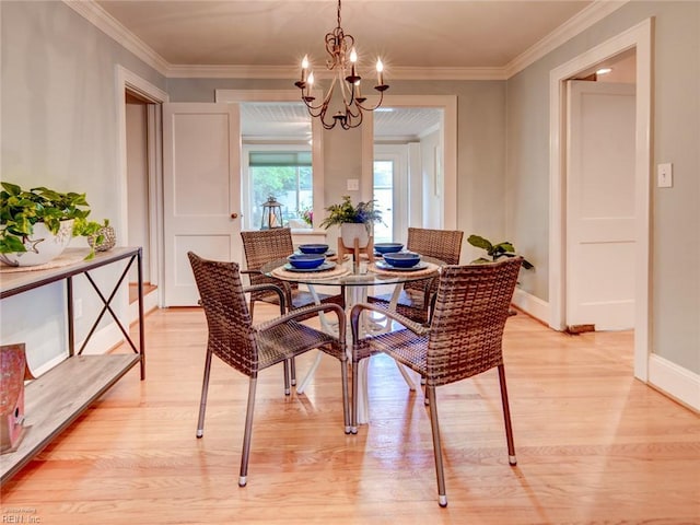 203 Sinclair St, Norfolk, VA 23505 - dining room featuring light wood-type flooring, a chandelier, crown molding, and baseboards