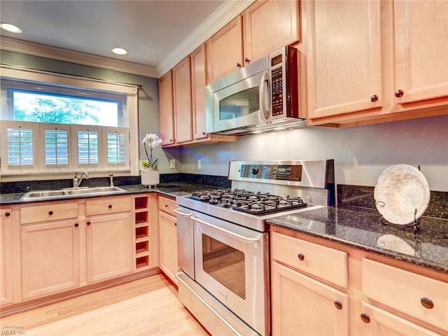 203 Sinclair St, Norfolk, VA 23505 - kitchen with white range with gas stovetop, stainless steel microwave, a sink, ornamental molding, and light wood-style floors