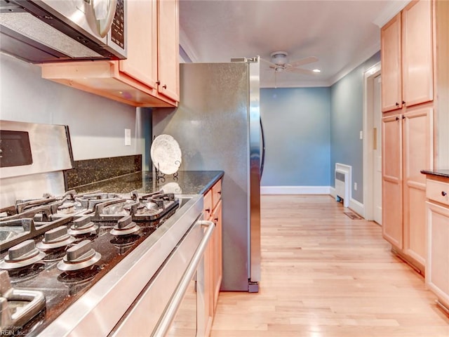 203 Sinclair St, Norfolk, VA 23505 - kitchen with range, stainless steel microwave, a ceiling fan, light wood-type flooring, and baseboards