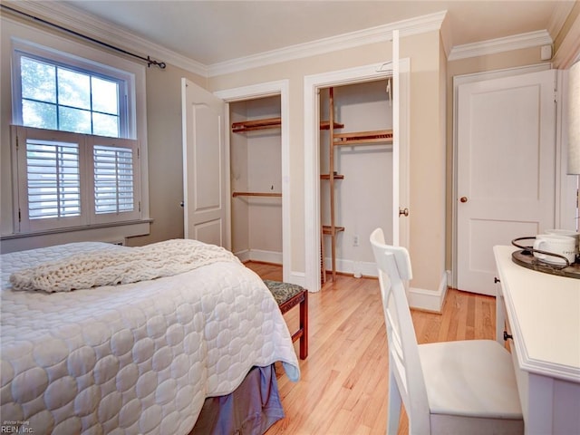 203 Sinclair St, Norfolk, VA 23505 - bedroom featuring light wood finished floors, ornamental molding, two closets, and baseboards