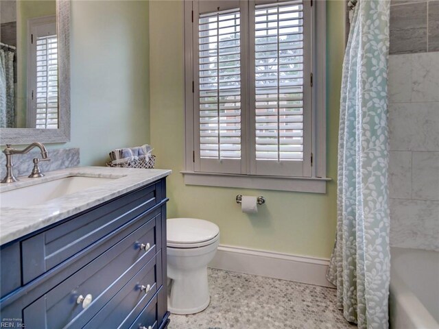 203 Sinclair St, Norfolk, VA 23505 - bathroom with vanity, baseboards, toilet, and shower / tub combo with curtain