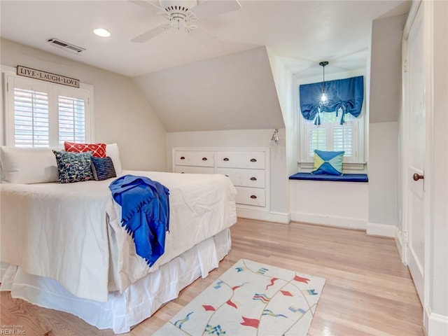 203 Sinclair St, Norfolk, VA 23505 - bedroom featuring multiple windows, light wood-style floors, vaulted ceiling, baseboards, and a ceiling fan