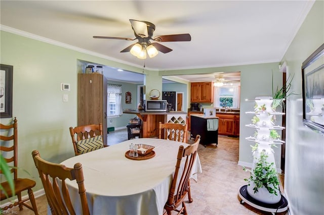 9206 Dixon Rd, Suffolk, VA 23433 - dining room with ceiling fan, crown molding, and baseboards