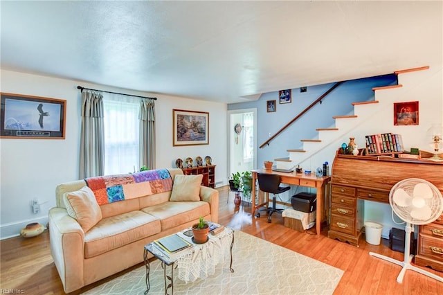 9206 Dixon Rd, Suffolk, VA 23433 - living room with wood finished floors, stairway, and baseboards