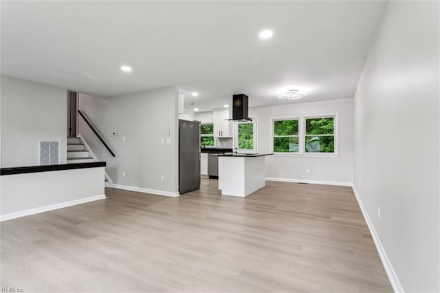 428 Maryle Ct, Newport News, VA 23602 - unfurnished living room featuring light wood-style floors, recessed lighting, baseboards, and stairway
