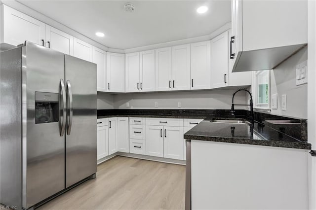 428 Maryle Ct, Newport News, VA 23602 - kitchen with stainless steel fridge, white cabinetry, a sink, light wood-style flooring, and dark stone counters