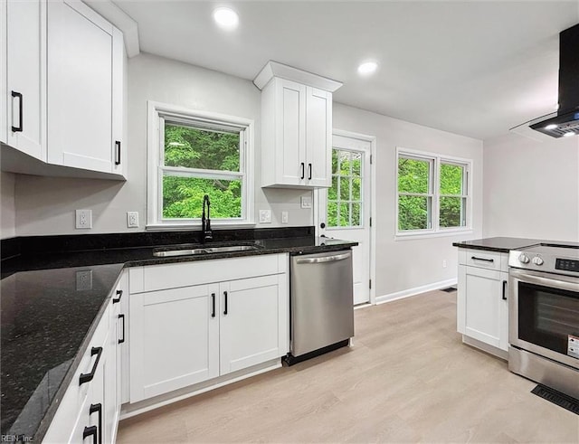 428 Maryle Ct, Newport News, VA 23602 - kitchen with appliances with stainless steel finishes, a sink, wall chimney exhaust hood, white cabinets, and dark stone countertops