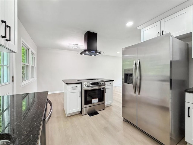 428 Maryle Ct, Newport News, VA 23602 - kitchen featuring stainless steel appliances, island range hood, white cabinetry, light wood-style flooring, and dark stone counters