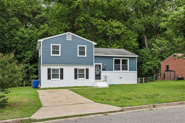 428 Maryle Ct, Newport News, VA 23602 - tri-level home with a front yard, brick siding, driveway, and roof with shingles