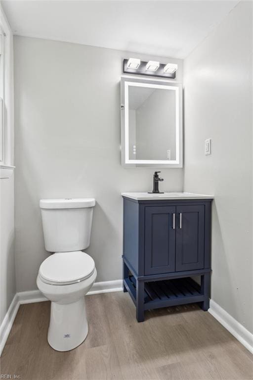 428 Maryle Ct, Newport News, VA 23602 - half bath with wood finished floors, vanity, toilet, and baseboards