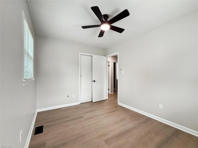 428 Maryle Ct, Newport News, VA 23602 - unfurnished bedroom featuring baseboards, wood finished floors, a closet, and ceiling fan