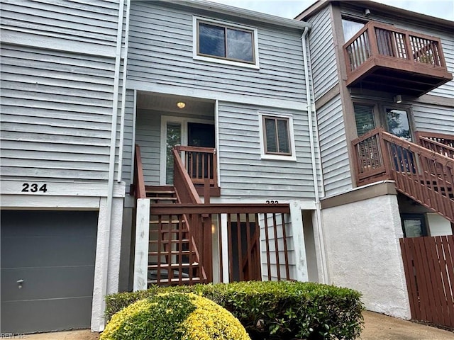 232 Mill Point Dr, Hampton, VA 23669 - back of house with stairs, a balcony, and an attached garage