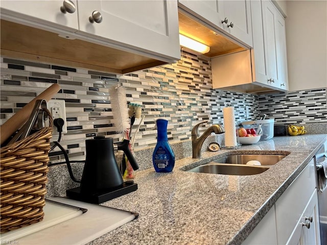 232 Mill Point Dr, Hampton, VA 23669 - kitchen featuring a sink, tasteful backsplash, and light stone counters