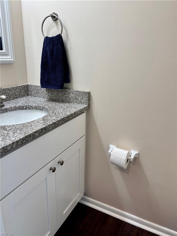 232 Mill Point Dr, Hampton, VA 23669 - bathroom featuring vanity, baseboards, and wood finished floors
