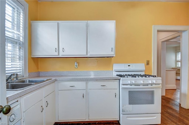 751 Shirley Ave, Norfolk, VA 23517 - kitchen featuring white gas stove, a sink, light countertops, and white cabinets