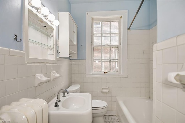 751 Shirley Ave, Norfolk, VA 23517 - bathroom with tile walls, toilet, shower / bath combination, a wainscoted wall, and a sink