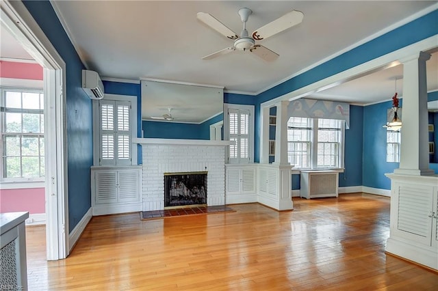 751 Shirley Ave, Norfolk, VA 23517 - unfurnished living room featuring a ceiling fan, decorative columns, ornamental molding, light wood finished floors, and a wall mounted AC