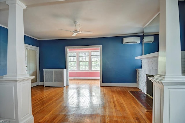 751 Shirley Ave, Norfolk, VA 23517 - unfurnished living room with decorative columns, radiator heating unit, a ceiling fan, a wall unit AC, and crown molding