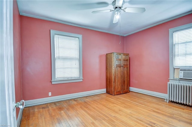 751 Shirley Ave, Norfolk, VA 23517 - unfurnished room featuring radiator heating unit, hardwood / wood-style floors, baseboards, a ceiling fan, and ornamental molding