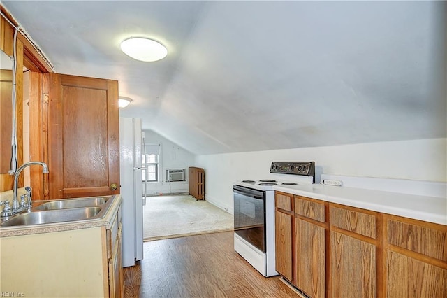 751 Shirley Ave, Norfolk, VA 23517 - kitchen with range with electric cooktop, a sink, freestanding refrigerator, lofted ceiling, and wood finished floors