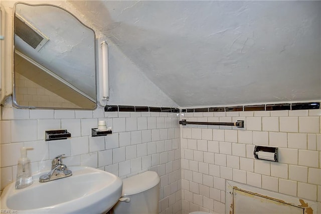 751 Shirley Ave, Norfolk, VA 23517 - half bath with toilet, a sink, vaulted ceiling, and tile walls
