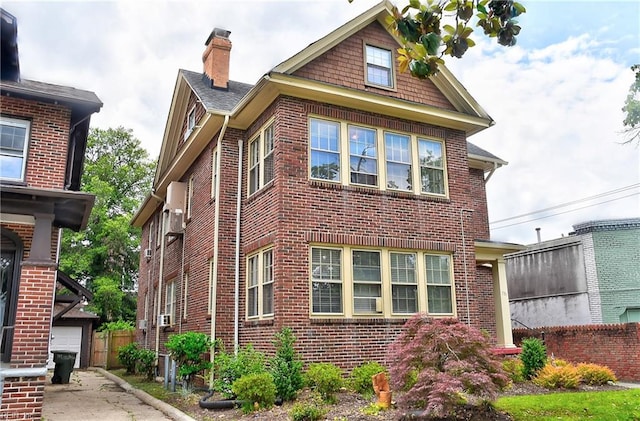 751 Shirley Ave, Norfolk, VA 23517 - view of side of home featuring a chimney, brick siding, and an outbuilding