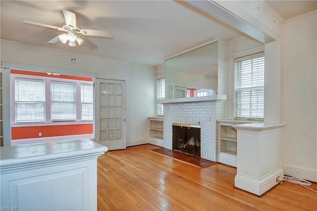 751 Shirley Ave, Norfolk, VA 23517 - unfurnished living room with ceiling fan, light wood-style flooring, baseboards, a fireplace, and crown molding