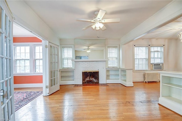 751 Shirley Ave, Norfolk, VA 23517 - unfurnished living room with radiator, light wood-type flooring, a ceiling fan, and baseboards