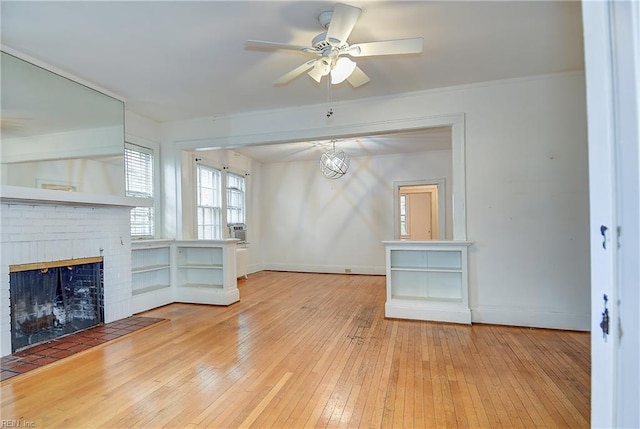 751 Shirley Ave, Norfolk, VA 23517 - unfurnished living room with a ceiling fan, a fireplace, hardwood / wood-style floors, and baseboards