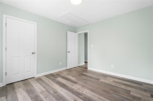 2915 Berkley Ave, Chesapeake, VA 23325 - unfurnished bedroom with attic access, wood finished floors, and baseboards